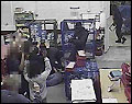 Hold-up ... members of the gang point guns at staff in the depot heist